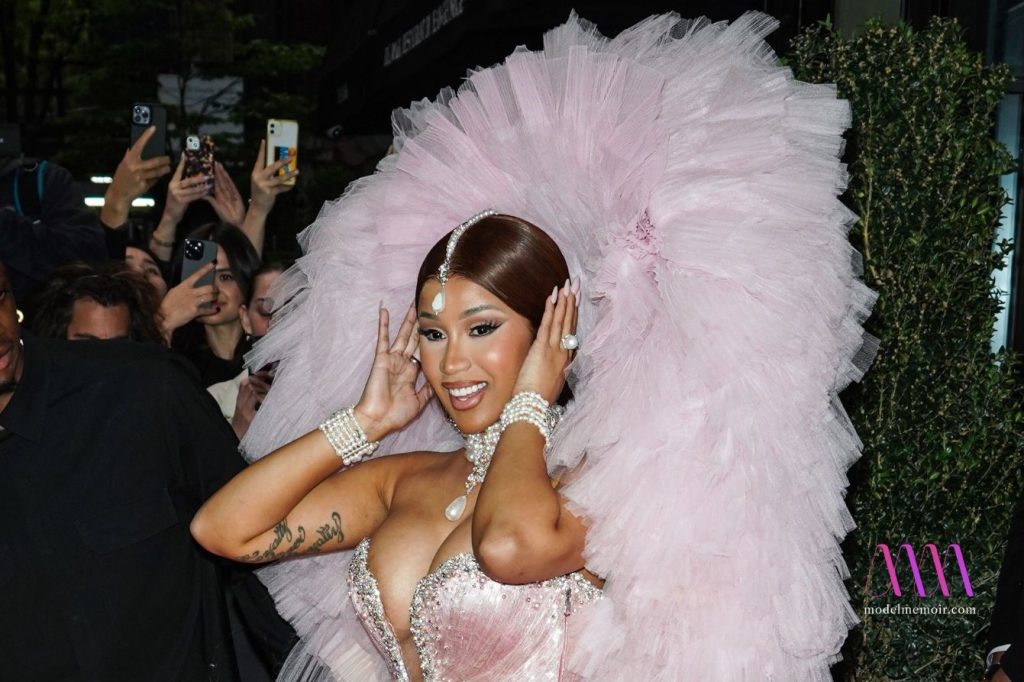 A photo of Cardi B wearing a stunning pink dress.