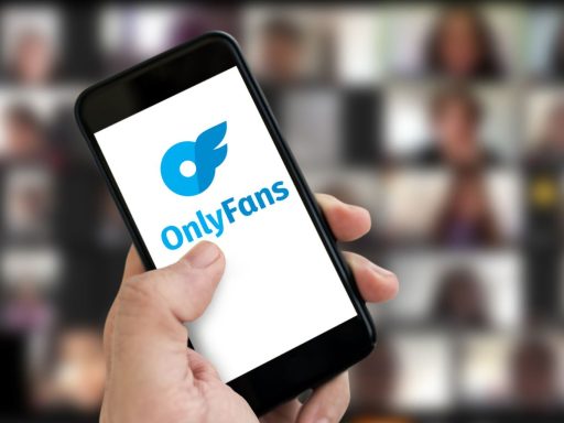 A photo of a phone screen showing OnlyFans logo.