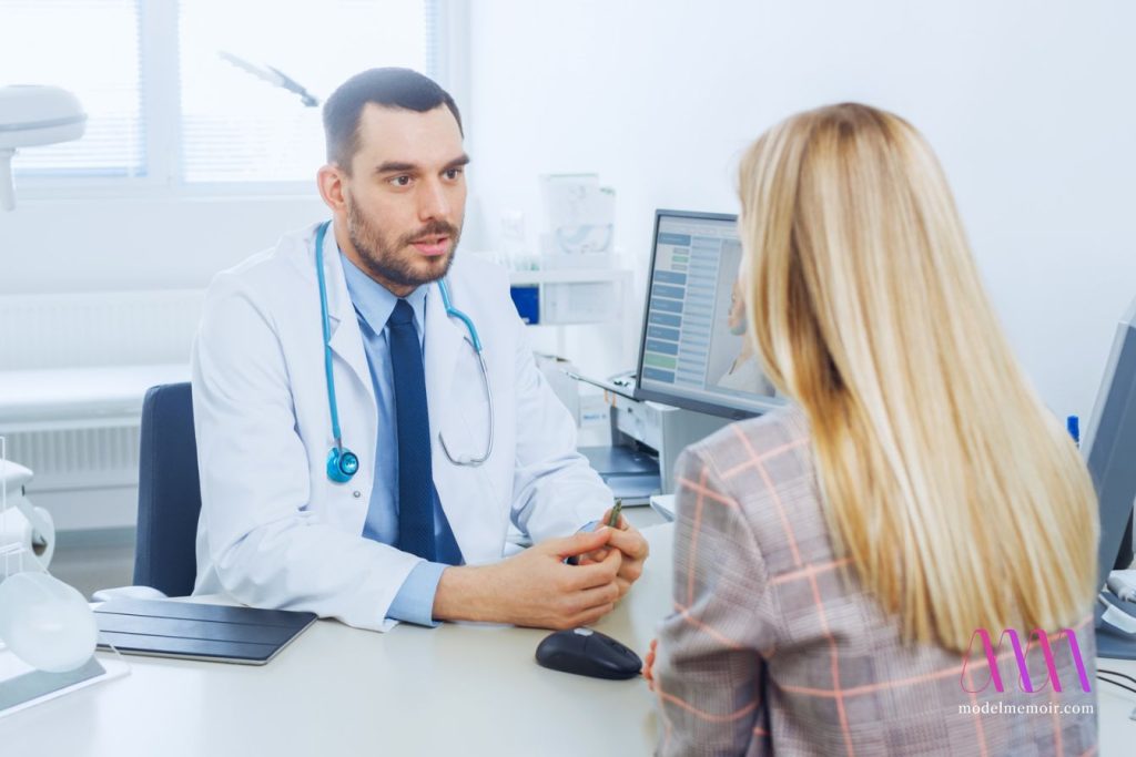 Blond woman consulting with a doctor before becoming a pornstar.