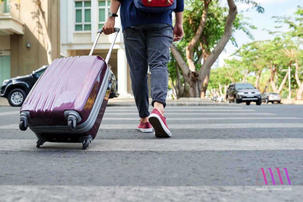 A man with a packed suitcase.