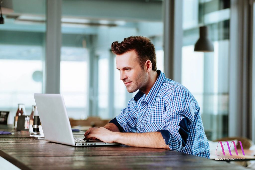 A man browsing on computer.