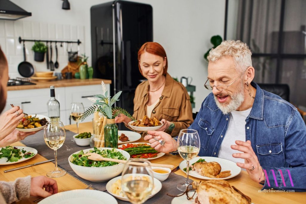 Cheerful bearded man in eyeglasses talking to family.