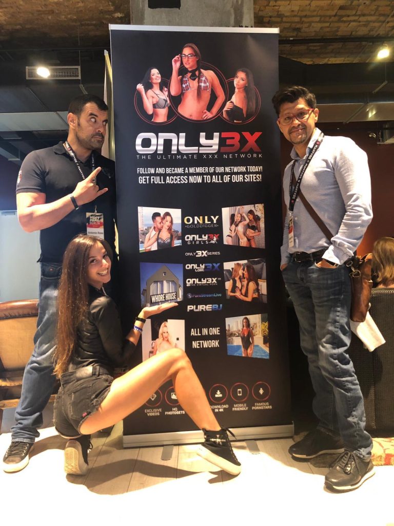 Amirah Adara posing with friends at Only3X event.