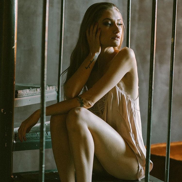 Tiffany Tatum in a sensual photoshoot behind bars.